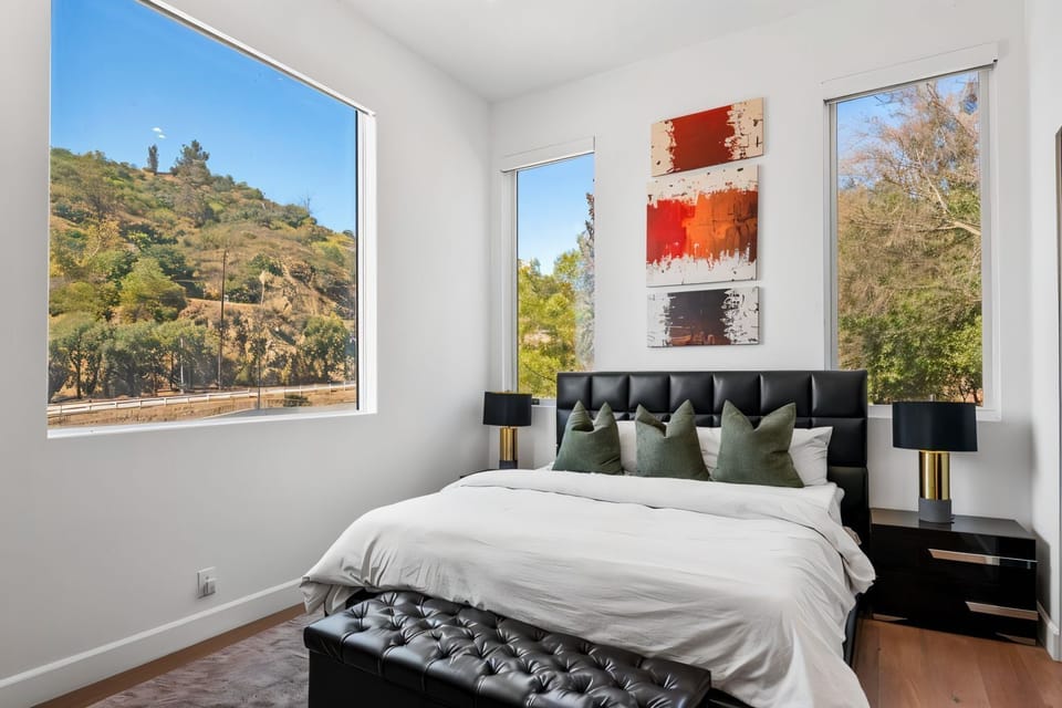 King bedroom with soft light and calm hillside energy