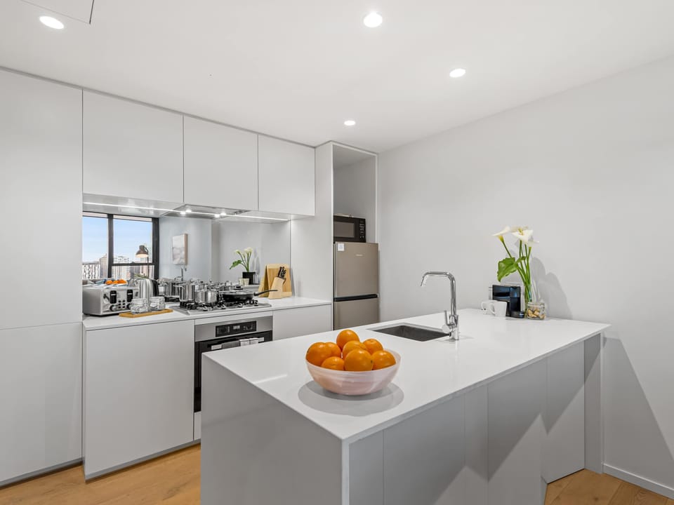 Modern and functional, the kitchen is ideal for longer stays or business trips. Enjoy the convenience of cooking at home with quality appliances and all the essentials to make dining in easy.