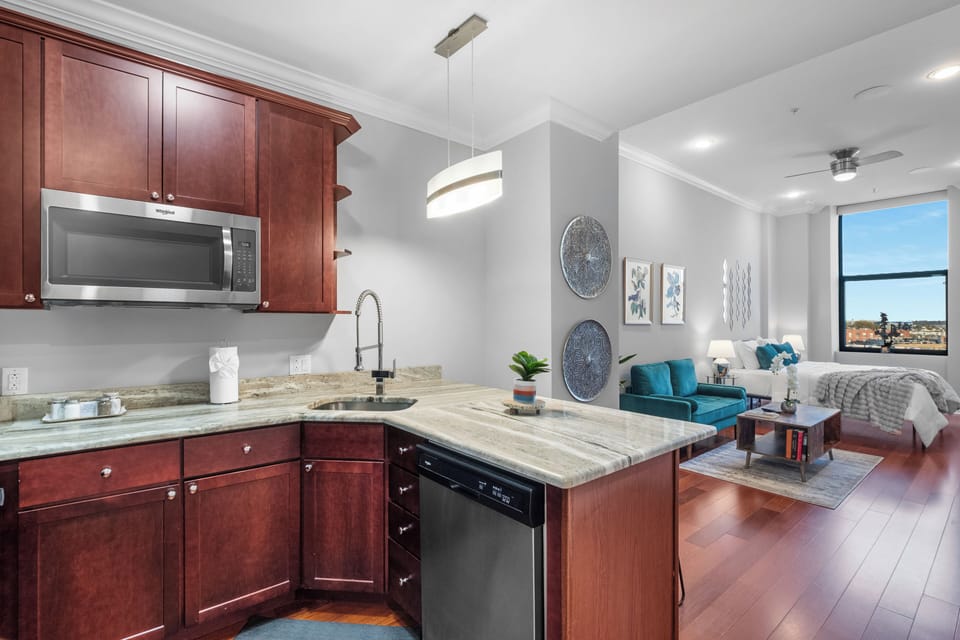 Bright and spacious kitchen featuring stainless steel appliances and everything you need to prepare meals.
