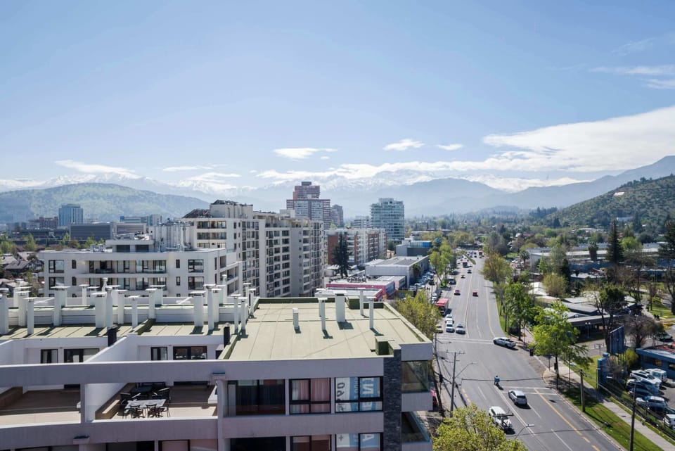 Marvel at breathtaking city and mountain vistas from this modern apartment. Perfect for enjoying the vibrant urban landscape. (Common Area)