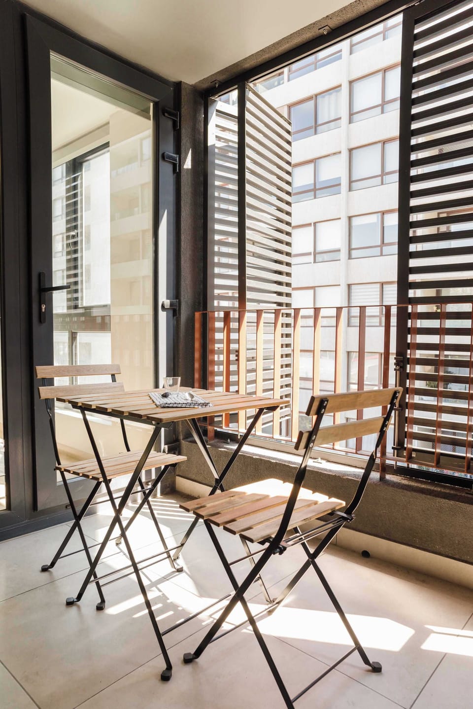 Relax on this charming balcony with your morning coffee, enjoying the cityscape views and fresh air.