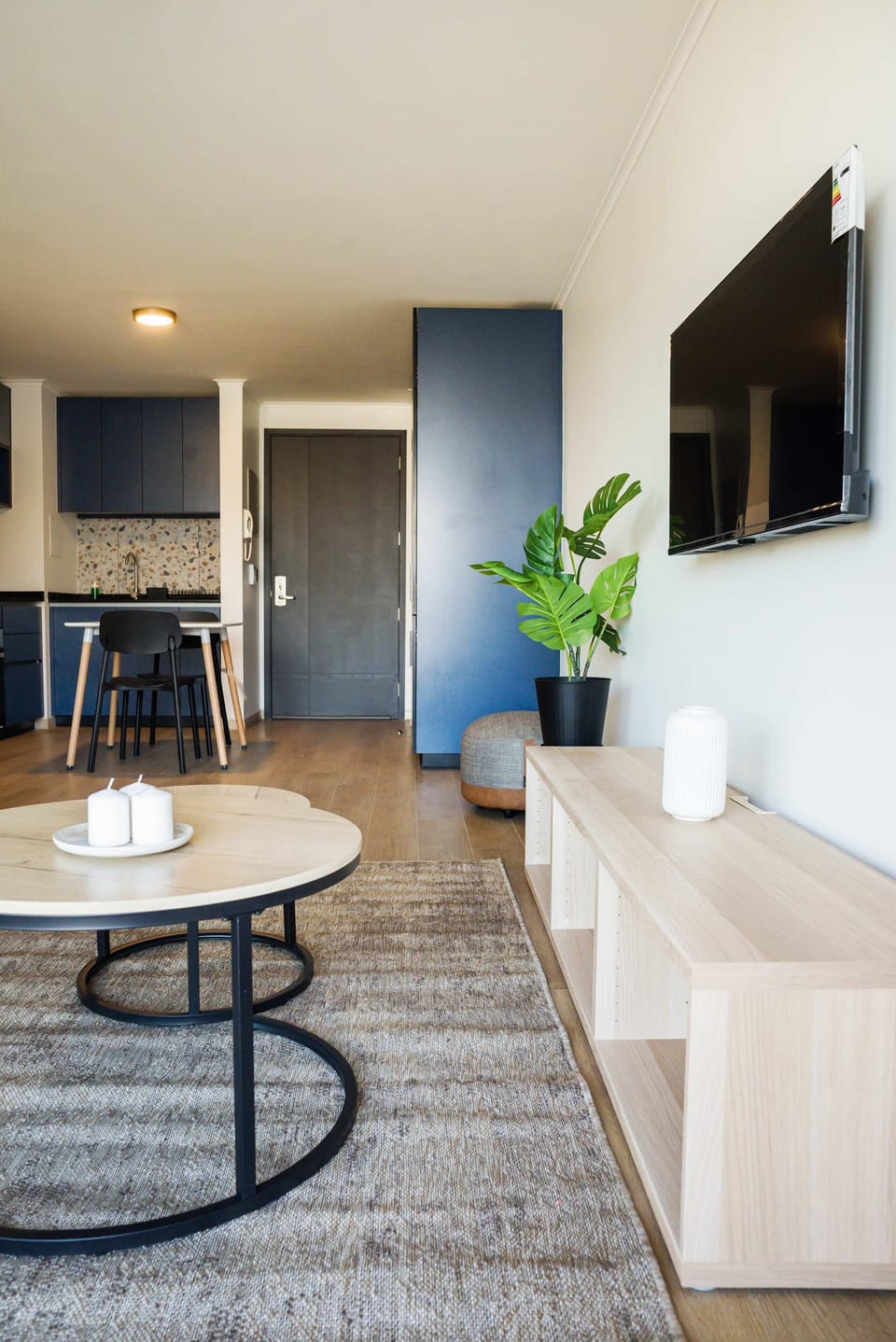 Modern living area with sleek decor and cozy seating, perfect for relaxation and entertainment.