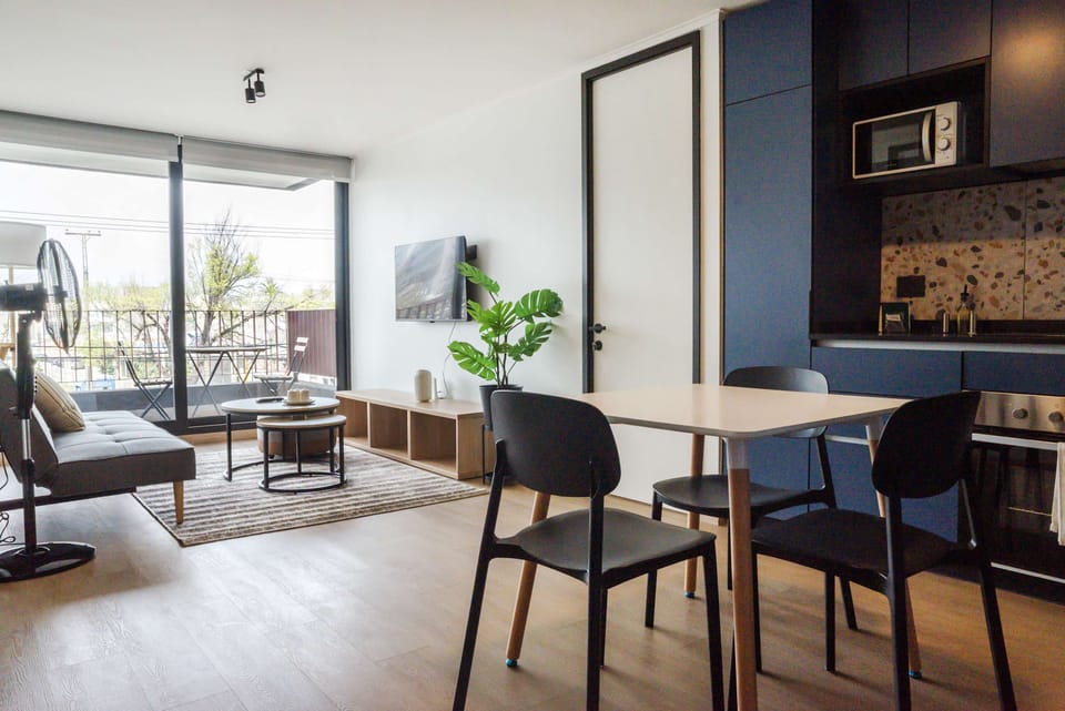 Bright and modern living area with a cozy balcony, perfect for relaxation and enjoying the view.