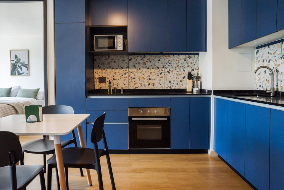 Sleek kitchen with modern amenities and stylish design, perfect for culinary adventures in your cozy Chilean apartment.