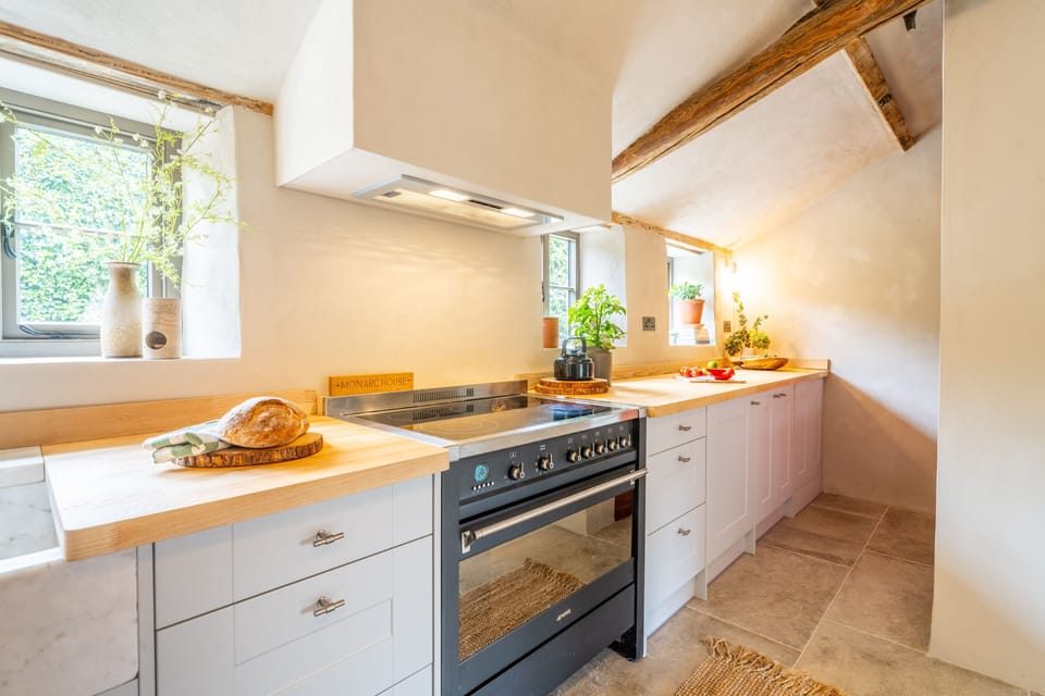 Ground floor: Kitchen and utility with an electric Range cooker and induction hob, fridge/freezer, washing machine and Nespresso coffee machine