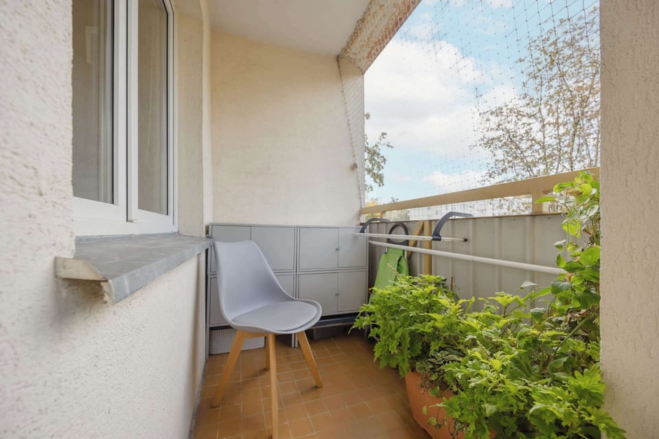 The balcony provides a perfect spot for enjoying the fresh air.