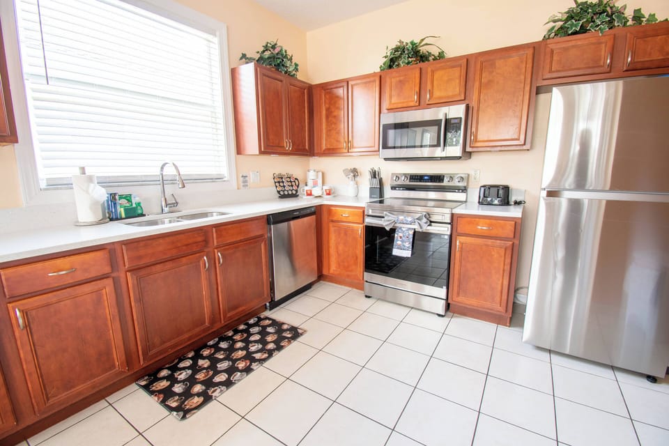 Fully equipped kitchen with modern appliances and a dining area for shared meals and celebrations.