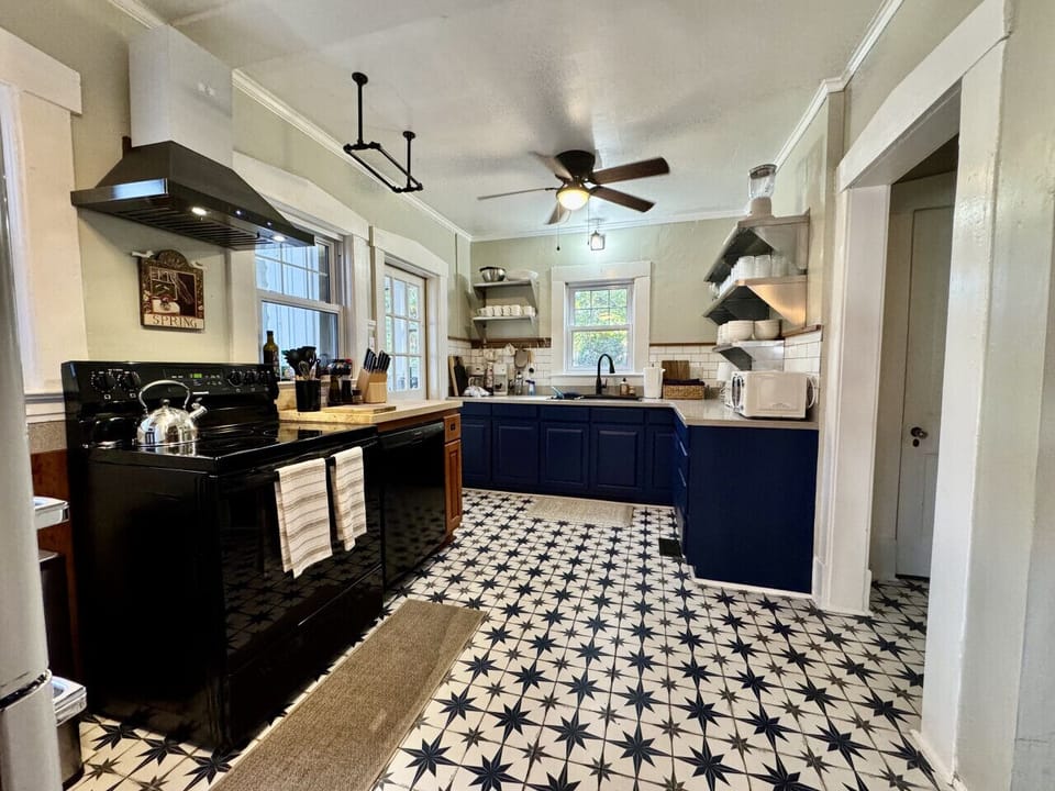 Large kitchen with retro style and all that you should need to prepare a meal.