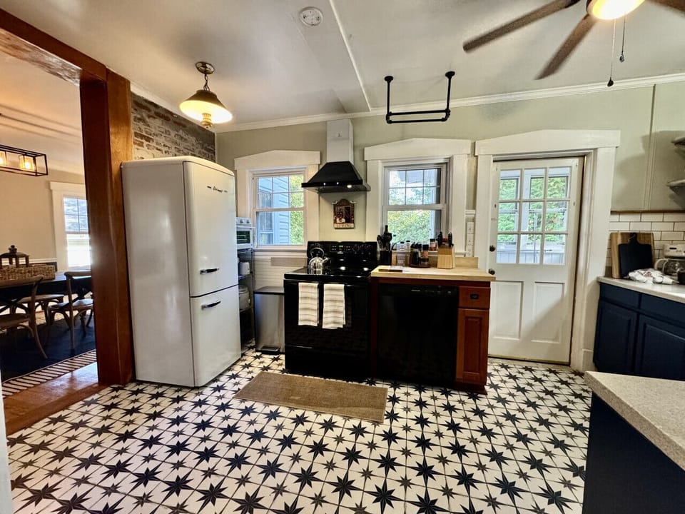 Large kitchen with retro style and all that you should need to prepare a meal.