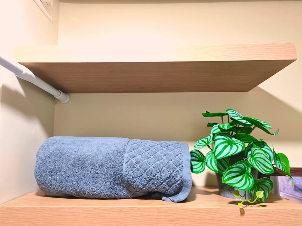 Soft towels & greenery add a clean, cozy, and inviting touch to your stay.