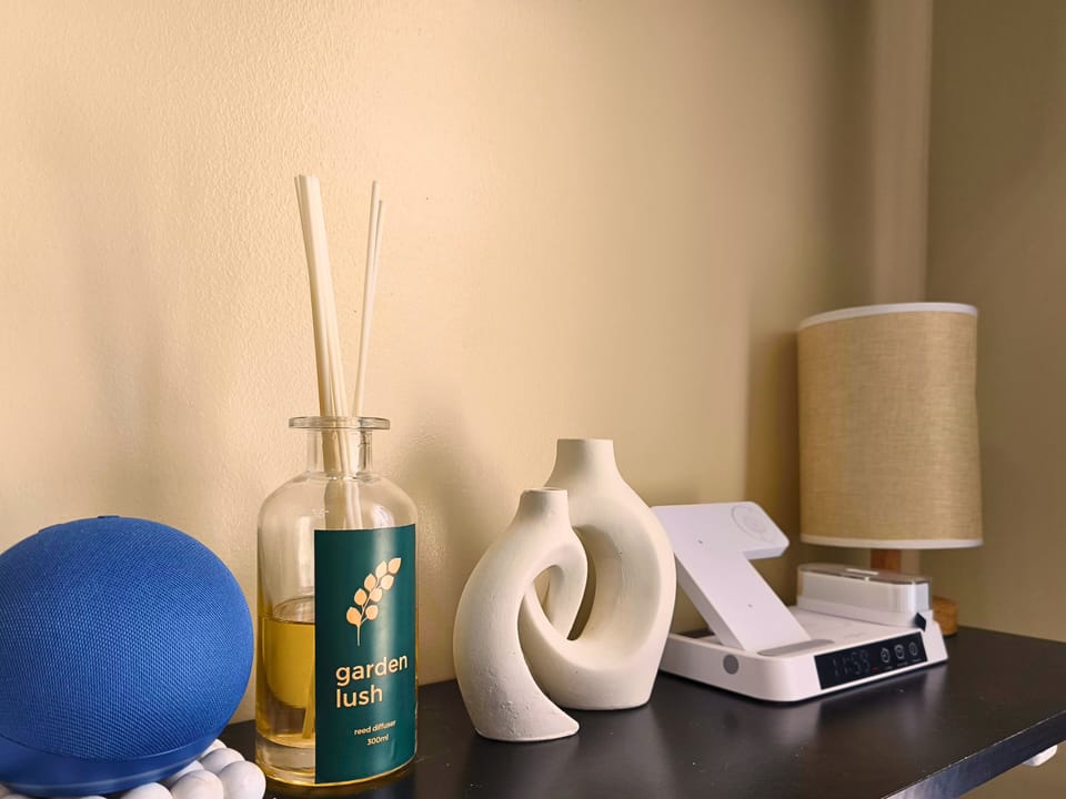 Alexa, decor & wireless charging add a modern, cozy touch to the room.