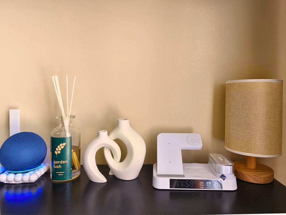 Modern setup with Alexa, diffuser & decor for a cozy, smart living space.