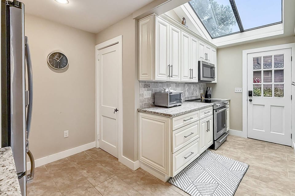 Rustic charm meets modern convenience—fully equipped kitchen for all your culinary needs.