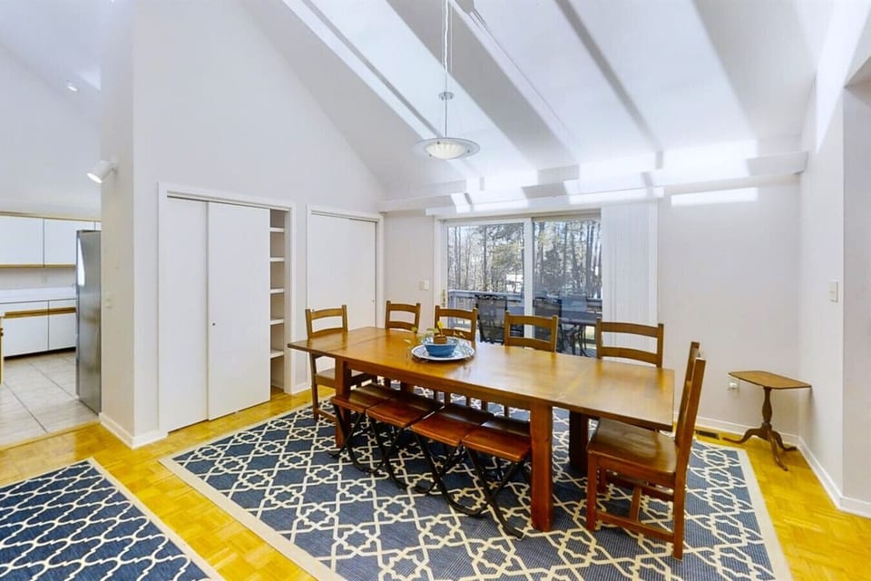 Gather around a spacious table that seats 10, with the lake as your backdrop.