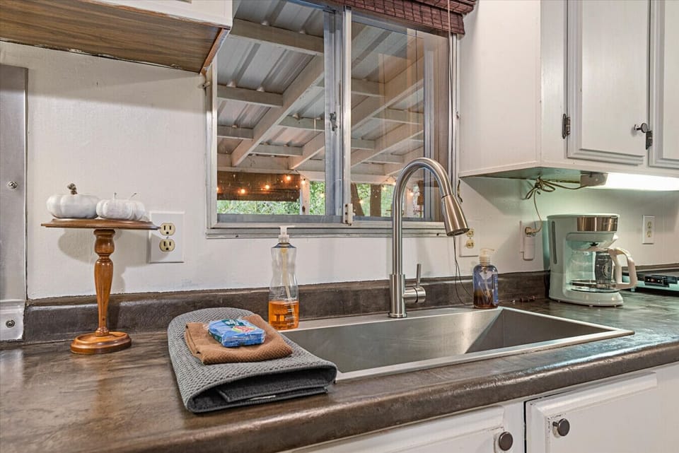 Kitchen sink with drip coffee maker nearby.  Locally roasted Sorbenots coffee complimentary.