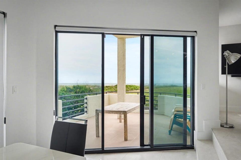 Step onto your private terrace through floor-to-ceiling glass doors and soak in panoramic views of lush greenery stretching to the horizon.