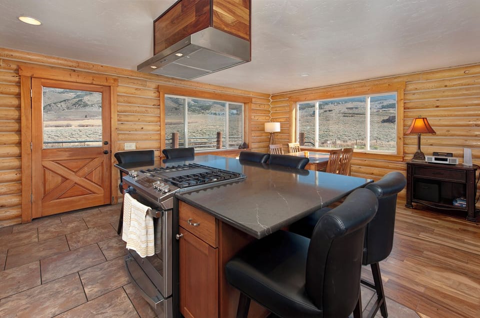 Fully stocked, gourmet kitchen with stainless steel appliances.