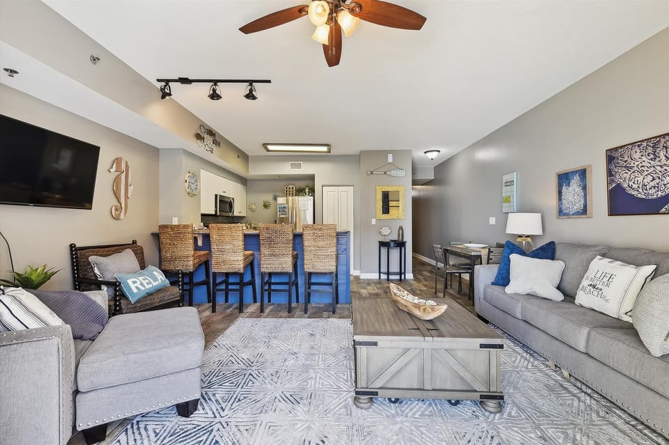 Living room with sleeper sofa and entrance onto the balcony.