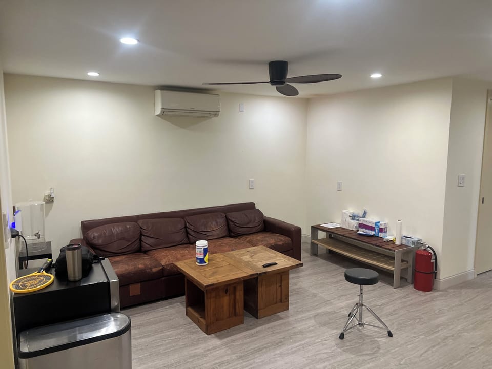 Common Room Sitting area with Leather couch and coffee table