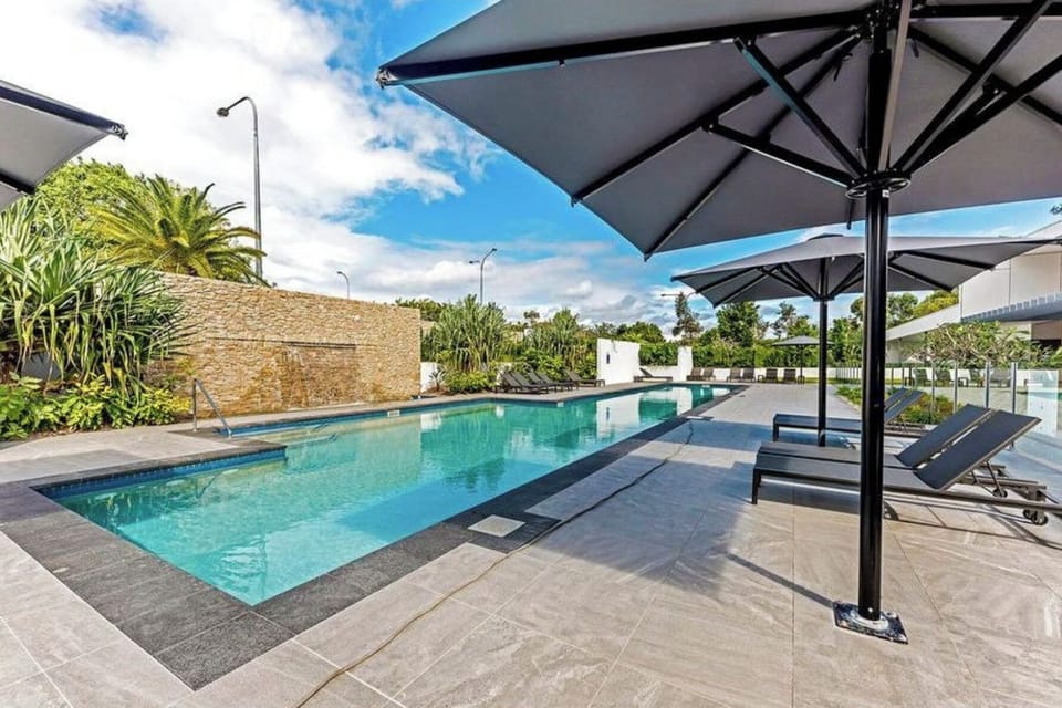 Resort style large pool with BBQ area, gym, sauna, golf simulator and cinema