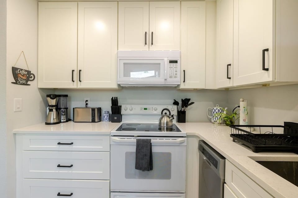 The coffee maker on has been upgraded to a Keurig, as shown in following photo.