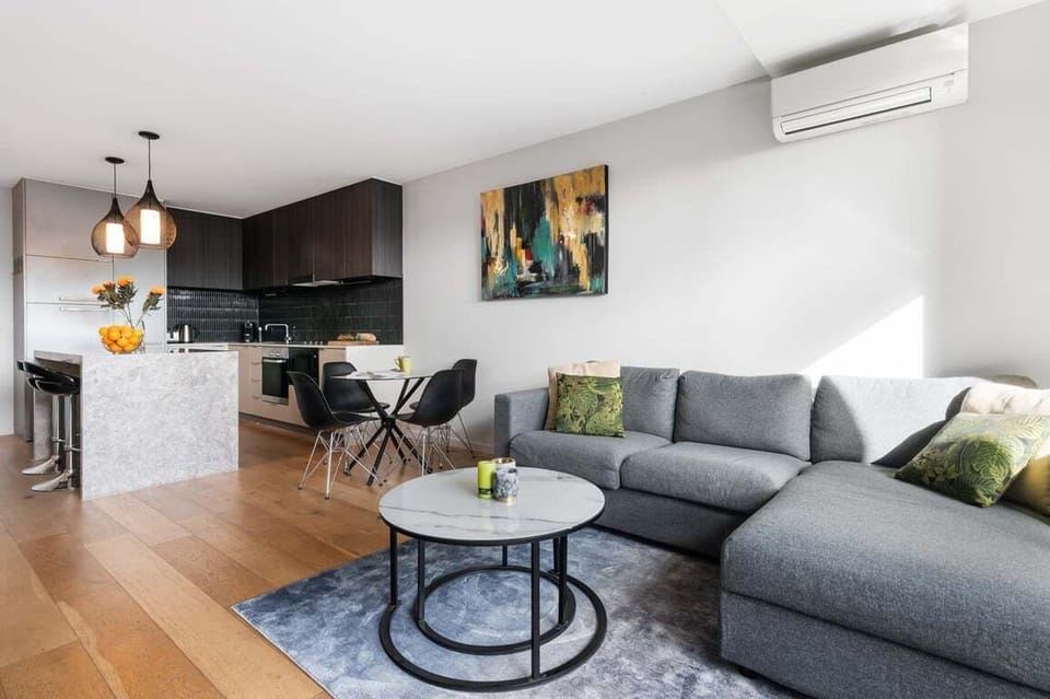 LOUNGE: The comfortable lounge sits next to the dining area and kitchen. Reverse cycle air-conditioning for year round comfort.