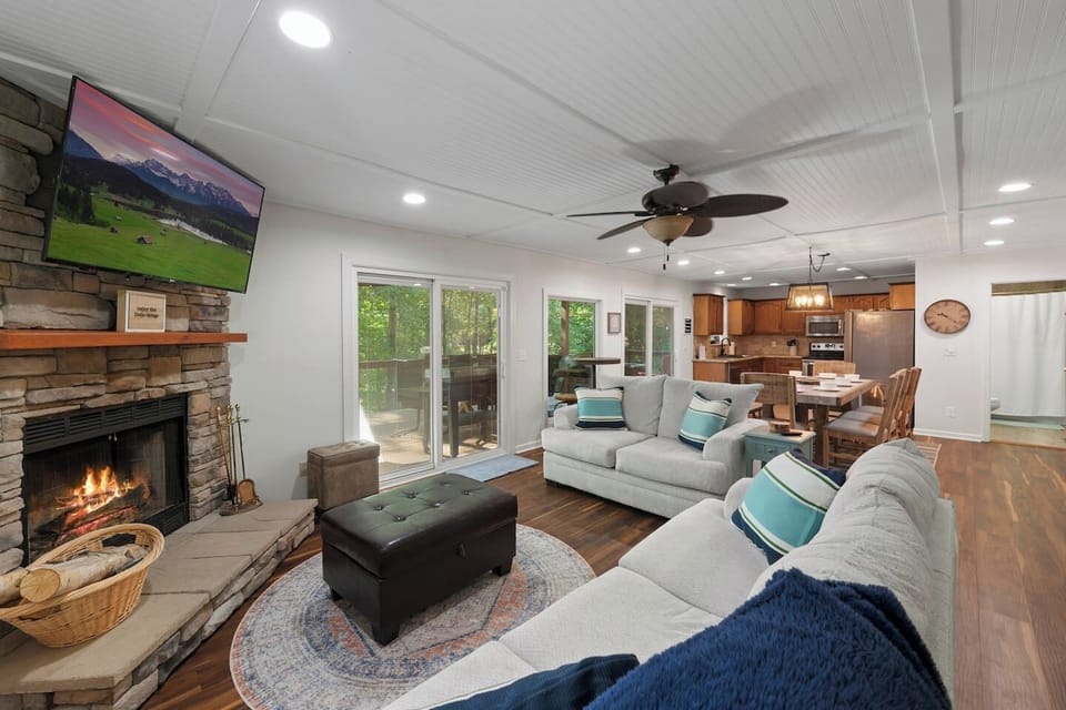 *Plush Couches*Wood burning fireplace (Seasonal from October - May) *55 in. flat screen tv (Bring your own login for streaming apps) 