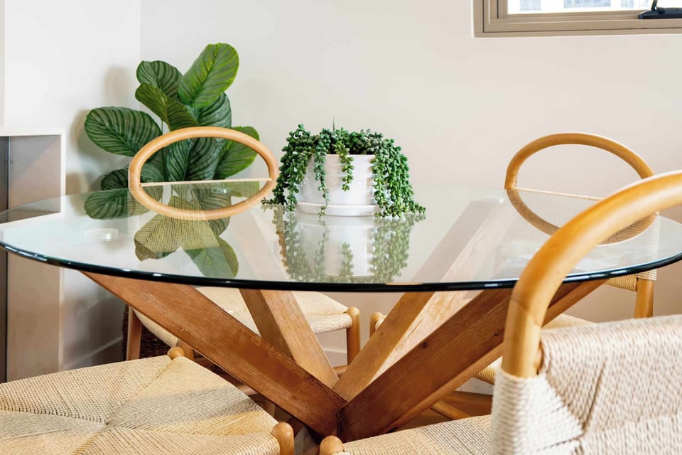 Gather around the dining table for shared meals, morning coffees, or relaxed dinners after a day at the beach.