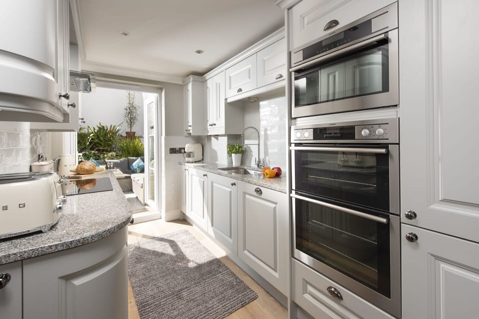 Kitchen with oven, microwave, and hob - Crystal View, Compass Point