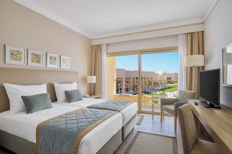 Relax by the window as resort gardens stretch beyond.