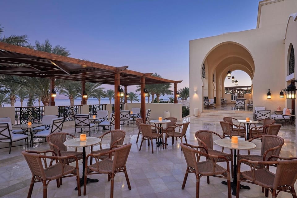 Sip at sunset on the terrace with lantern-lit charm.