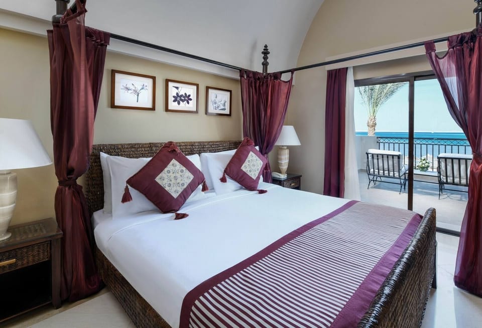 Indulge in a romantic canopy bed overlooking the ocean.