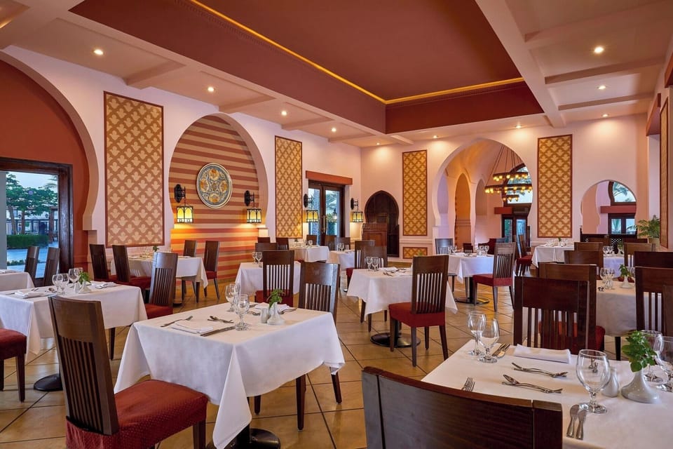 Gather for relaxed dinners under glowing ceilings and soft décor.