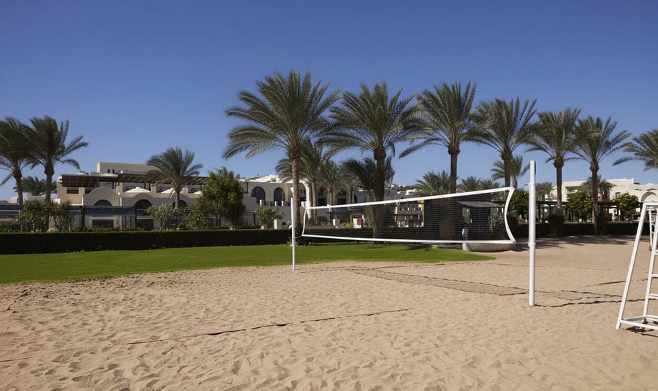 Challenge friends to sunset volleyball on soft, warm sand.