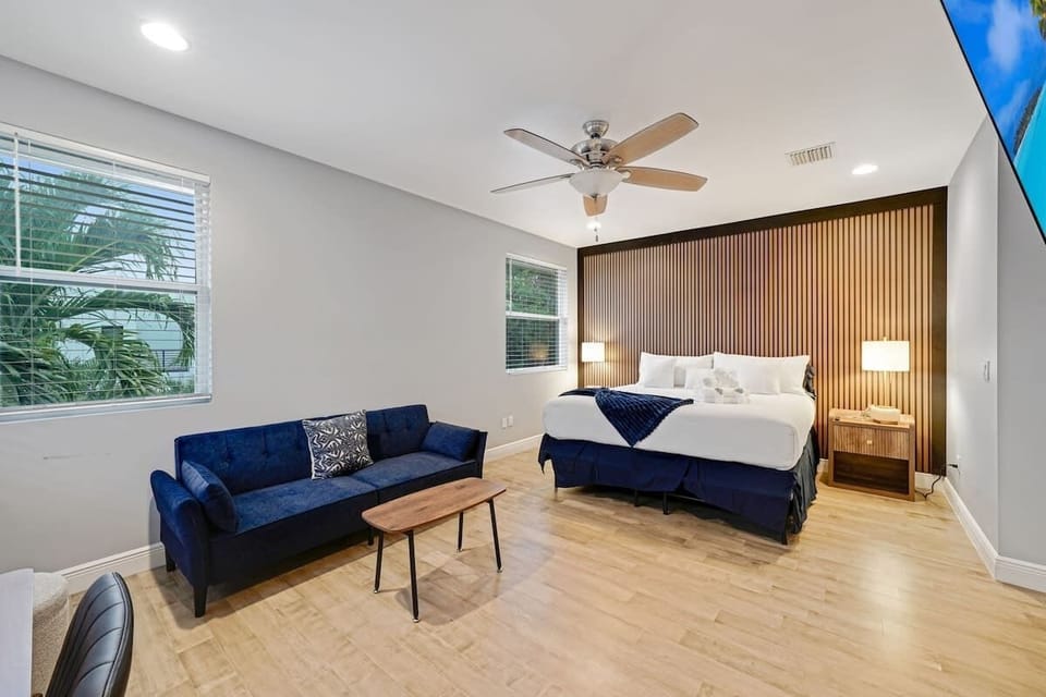 Your private retreat awaits — a spacious master bedroom designed for both rest and productivity. Unwind with your favorite shows on the TV, or stay focused with a dedicated work area that brings comfort and function together in one serene space.