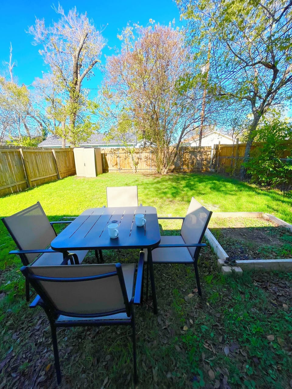 Relax and enjoy your morning coffee in the private backyard. 