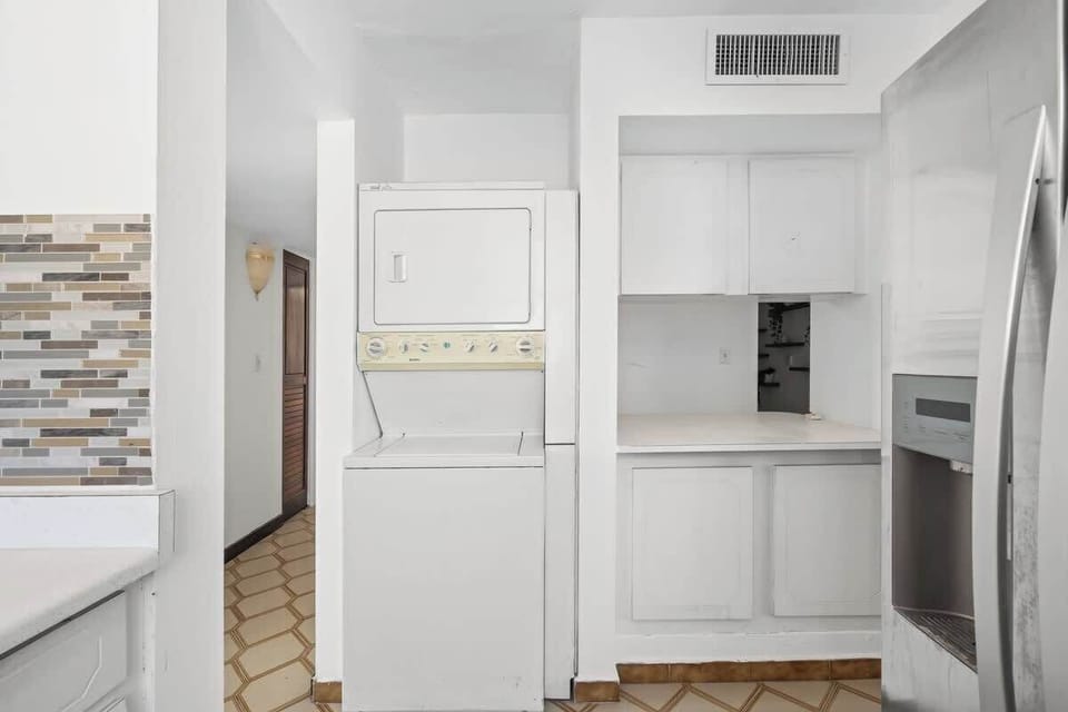 Experience the ease of a fully functional kitchen in your home away from home. With clean lines and essential appliances, it's perfect for preparing your favorite dishes.