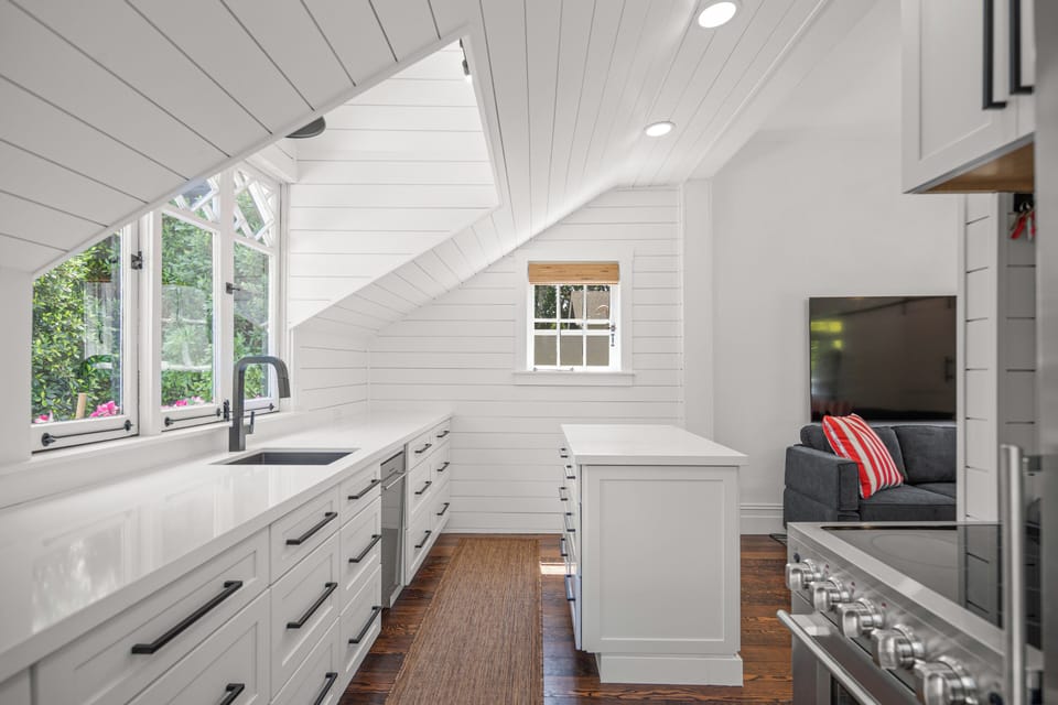 Kitchen looking to island and Family Room.