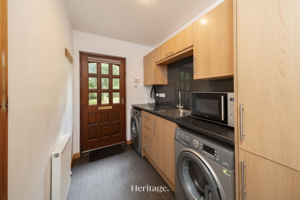 Utility room equipped with washing machine and dryer