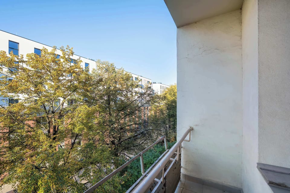 The balcony provides a perfect spot for enjoying the fresh air.