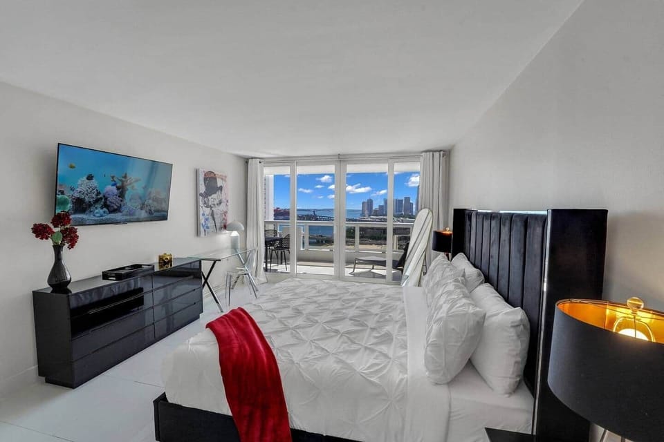 Master bedroom suite, king bed, Roku tv, balcony access, desk, private bathroom, walk in closet