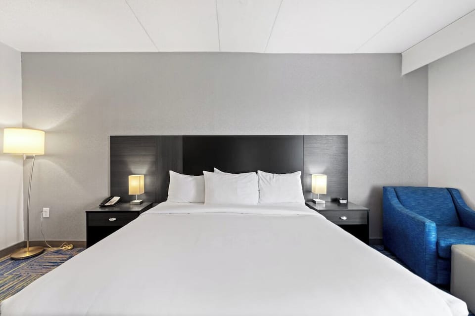 Sink into plush pillows and enjoy a calm, modern retreat.