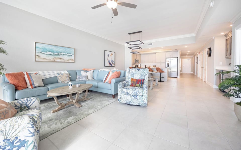Gather in this welcoming living space and enjoy stunning beach views through the windows