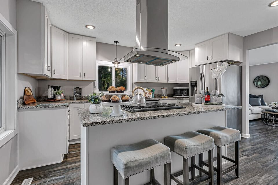 Fully Equipped Kitchen | Gas Range, Dishwasher, Bar Seating & Open Layout to Living Area