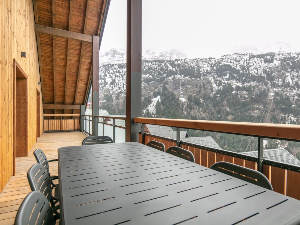 Gather for meals on the spacious terrace, perfect for enjoying the fresh mountain air.