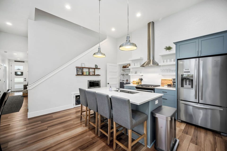 Kitchen and stairs to upper suite
