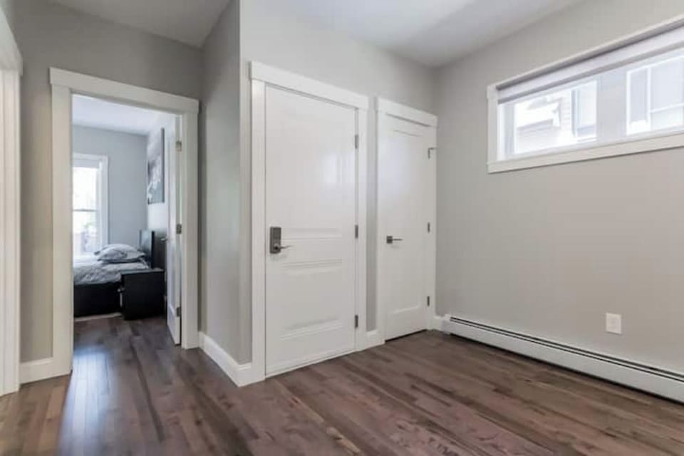Unit 1 - entrance to the condo view of the front door from the kitchen 