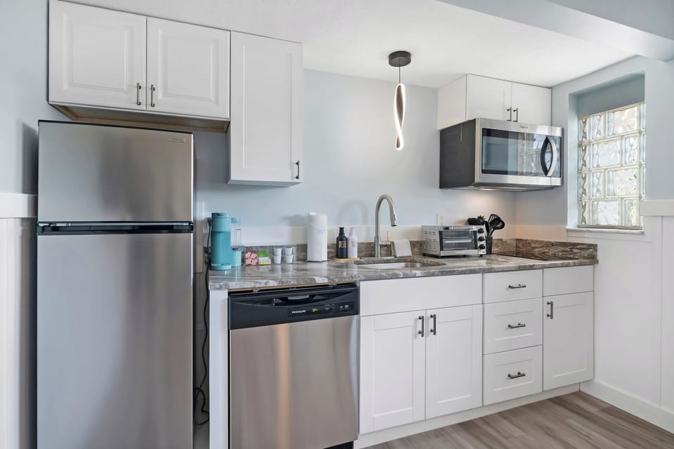 Brew coffee, prep snacks, toast breakfast—this kitchen fuels fun all day.