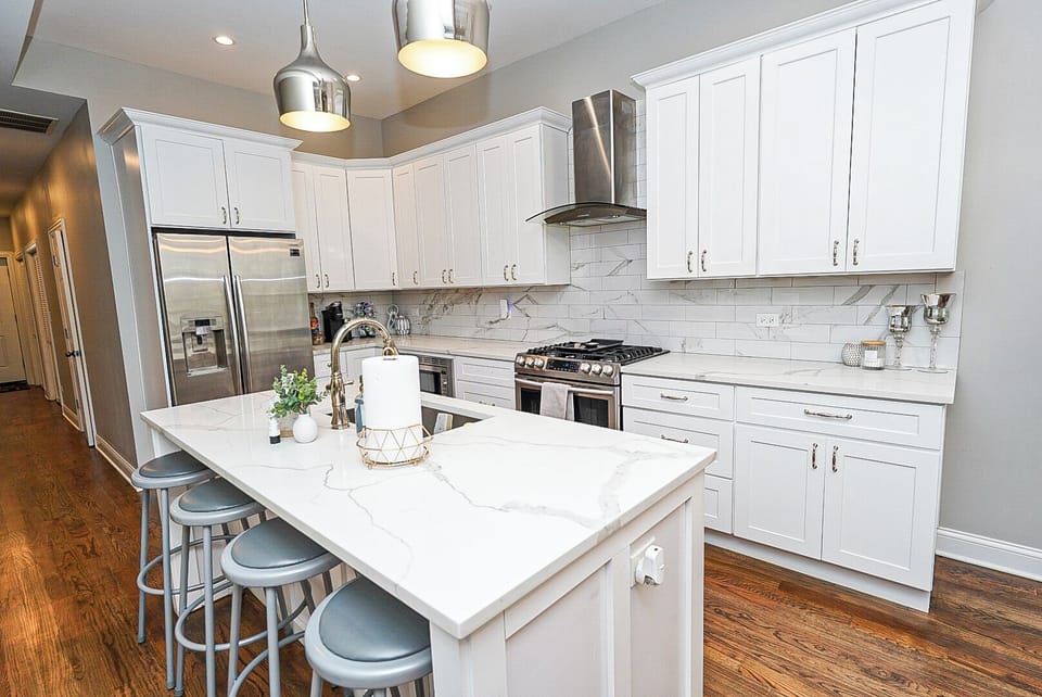 Large fully stocked kitchen with beautiful quartz countertops