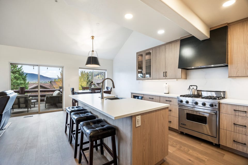 Perfect for preparing meals or enjoying a morning coffee while taking in the scenic views just beyond the sliding doors.